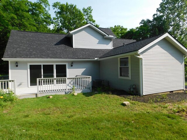 7326 State Route 19 Unit U3 L57-59, Mount Gilead, OH 43338 - rear view of house featuring a yard, roof with shingles, and a wooden deck