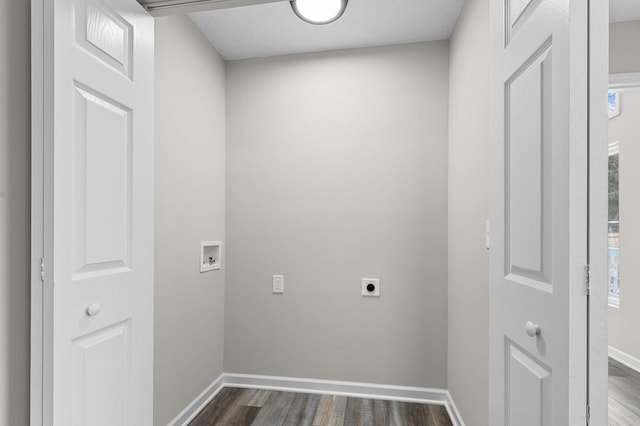 clothes washing area featuring dark wood-style flooring, hookup for a washing machine, electric dryer hookup, laundry area, and baseboards