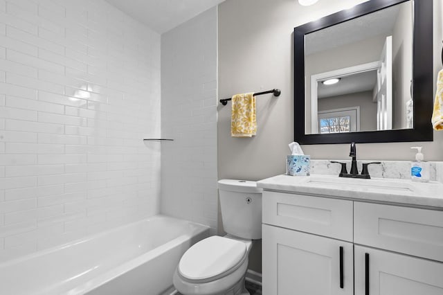 bathroom featuring shower / washtub combination, vanity, and toilet