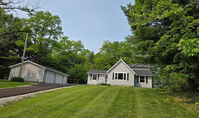 7326 State Route 19 Unit U3 L57-59, Mount Gilead, OH 43338 - single story home with an outbuilding, a detached garage, a front lawn, and view of scattered trees