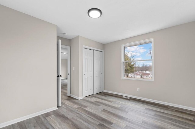 7326 State Route 19 Unit U3 L57-59, Mount Gilead, OH 43338 - unfurnished bedroom featuring wood finished floors and a closet