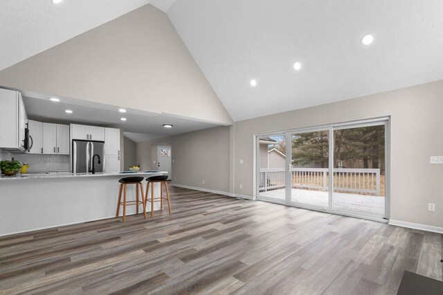 7326 State Route 19 Unit U3 L57-59, Mount Gilead, OH 43338 - unfurnished living room featuring high vaulted ceiling, light wood-type flooring, and recessed lighting