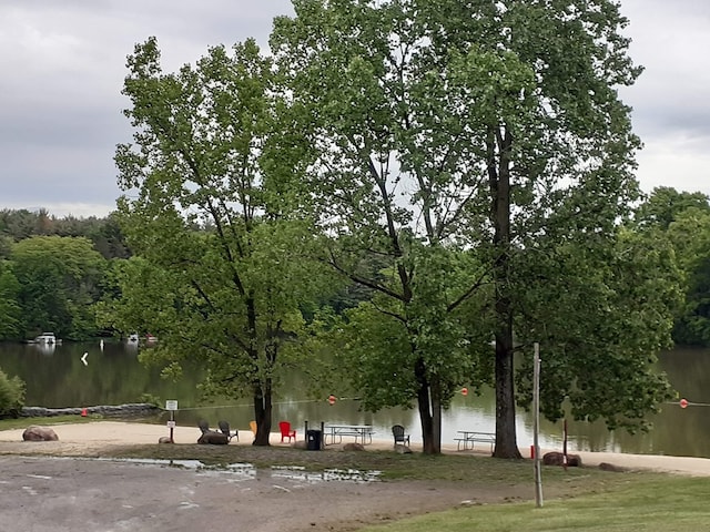 surrounding community featuring a water view