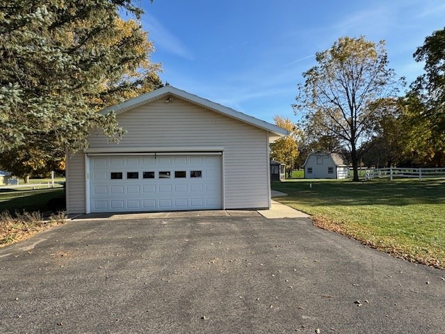 garage with a yard