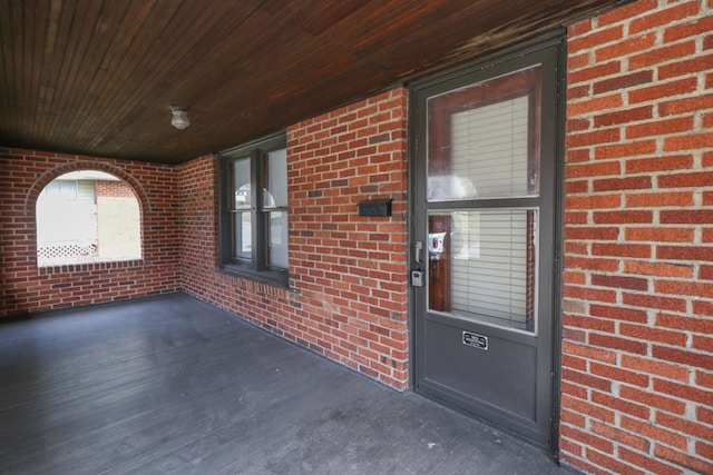 exterior space featuring brick siding