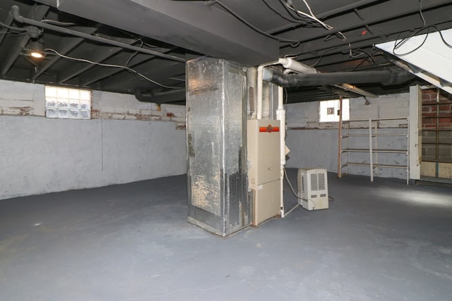 below grade area featuring heating unit