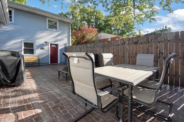 view of patio featuring a grill