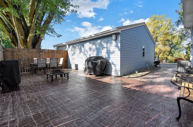 view of patio with grilling area and central AC