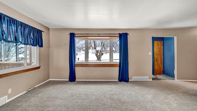 empty room featuring carpet flooring