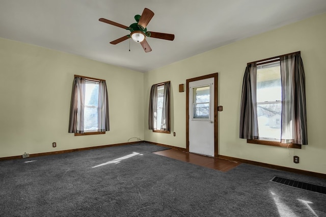 carpeted empty room with ceiling fan