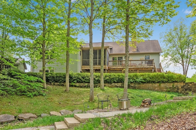 7326 State Route 19 Unit 1-2, Mount Gilead, OH 43338 - back of house featuring a sunroom, a deck, a shingled roof, and a yard