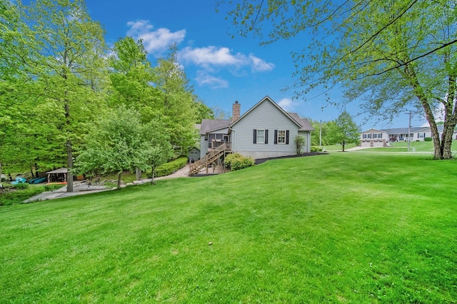 7326 State Route 19 Unit 1-2, Mount Gilead, OH 43338 - back of house featuring a chimney, a lawn, and stairs