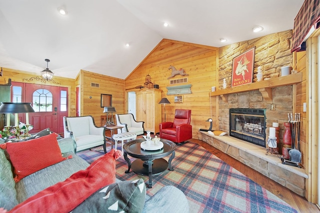 7326 State Route 19 Unit 1-2, Mount Gilead, OH 43338 - living area with wooden walls, lofted ceiling, a fireplace, and wood finished floors