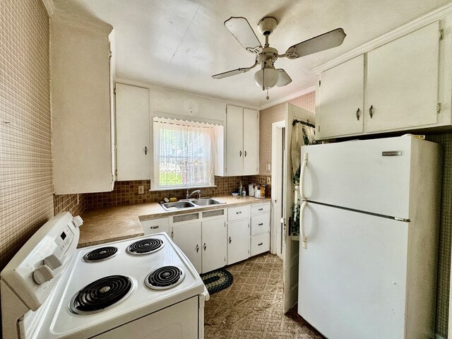 625 Grove Ave, Galion, OH 44833 - kitchen with white appliances, backsplash, ceiling fan, white cabinets, and light countertops