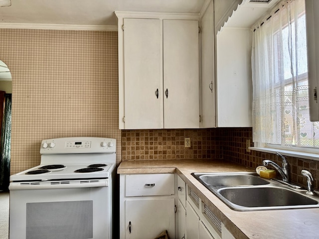 625 Grove Ave, Galion, OH 44833 - kitchen with electric stove, tasteful backsplash, light countertops, white cabinetry, and ornamental molding