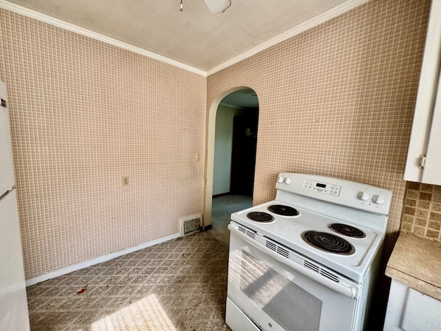 625 Grove Ave, Galion, OH 44833 - kitchen with white electric stove, ornamental molding, arched walkways, light countertops, and a ceiling fan