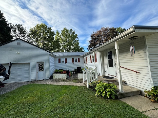 exterior space featuring a yard and a garage