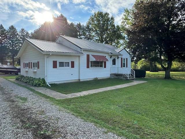 view of side of property with a yard