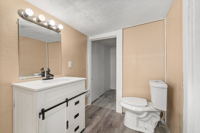 131 Sturges Ave, Mansfield, OH 44903 - half bathroom with vanity, a textured ceiling, and wood finished floors