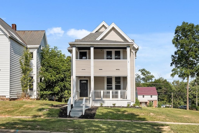 131 Sturges Ave, Mansfield, OH 44903 - view of front facade with covered porch and a front lawn