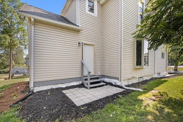 131 Sturges Ave, Mansfield, OH 44903 - back of property with entry steps, roof with shingles, and a lawn