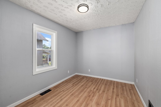 131 Sturges Ave, Mansfield, OH 44903 - empty room featuring light wood-type flooring and a textured ceiling