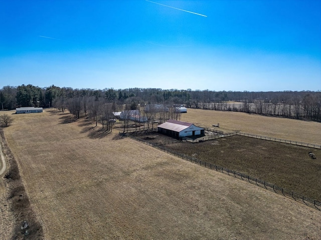 birds eye view of property with a rural view and a forest view