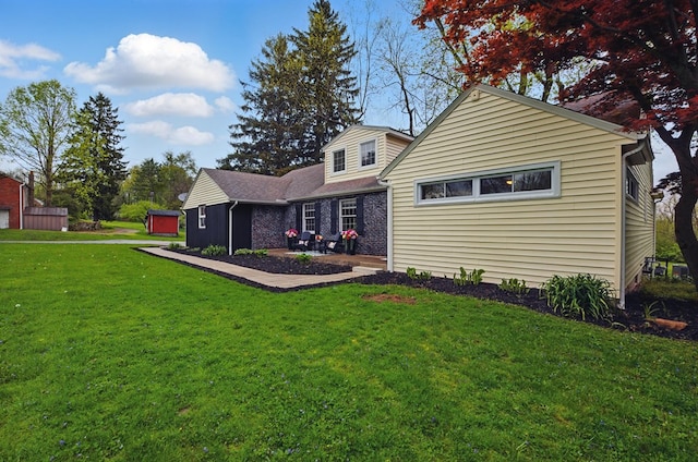 back of house featuring a patio and a yard