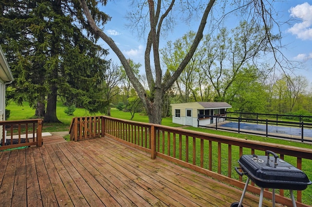 deck with an outbuilding and a yard