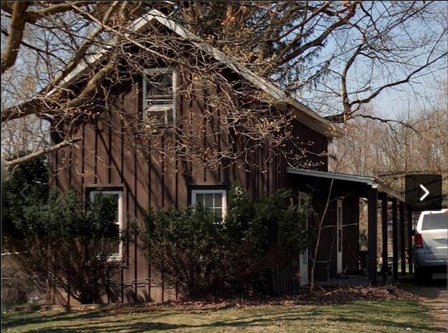 view of property exterior featuring a lawn