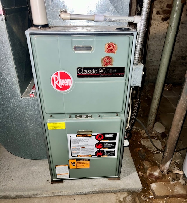 utility room featuring heating unit