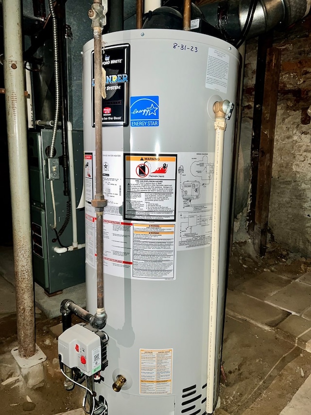 utility room with gas water heater