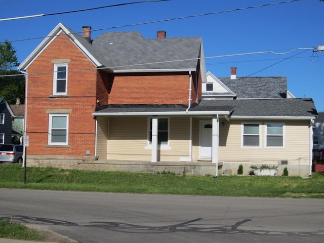 16 Earl Ave, Shelby, OH 44875 - view of front of property featuring a chimney, a porch, and brick siding