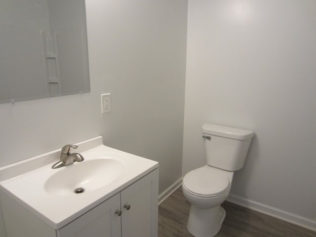 16 Earl Ave, Shelby, OH 44875 - half bath with wood finished floors, vanity, toilet, and baseboards