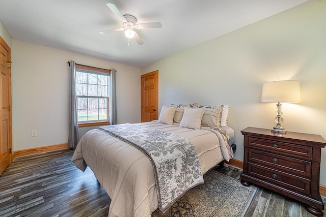 bedroom with dark wood-type flooring, baseboards, and ceiling fan