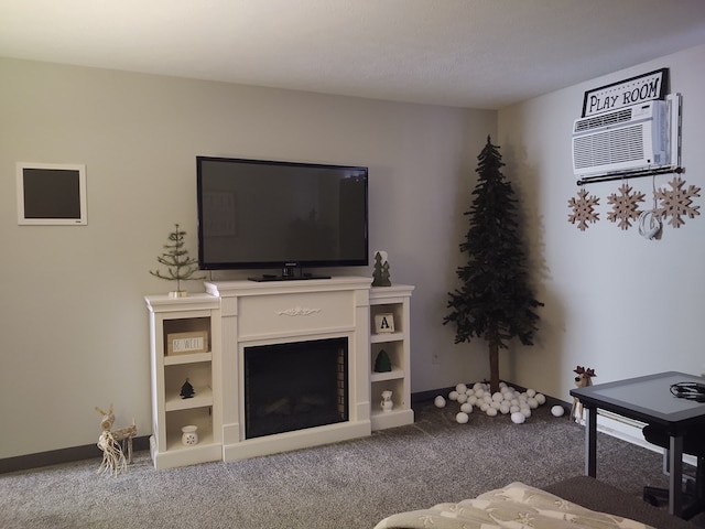 living area featuring baseboards, a fireplace, carpet flooring, and an AC wall unit