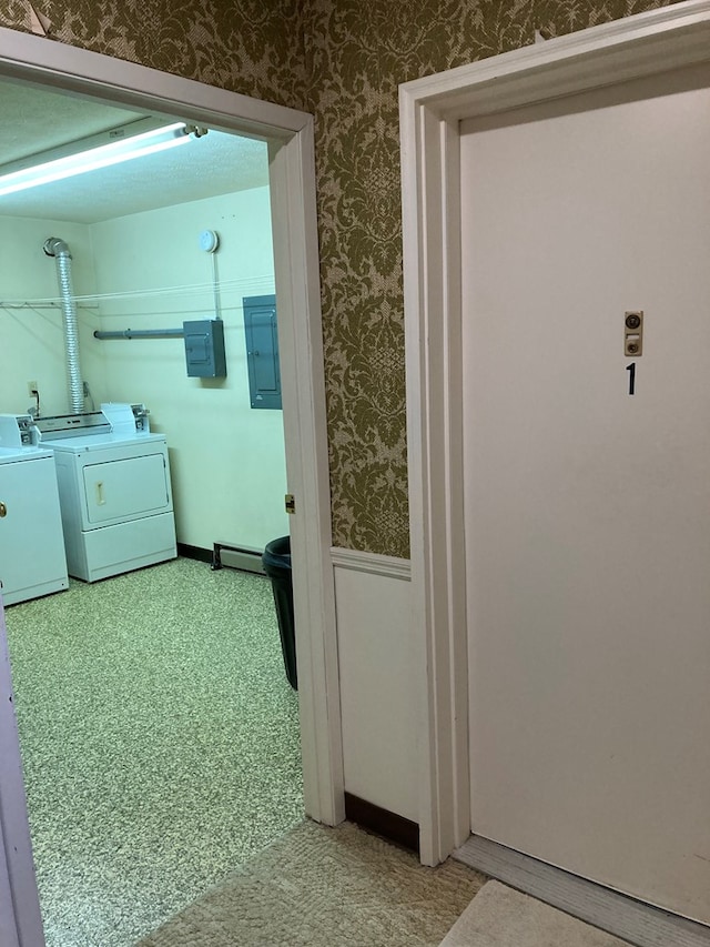 washroom with electric panel, laundry area, wallpapered walls, and washer and dryer