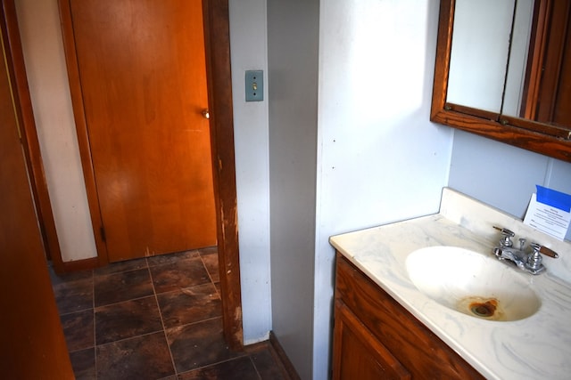 bathroom with vanity and baseboards