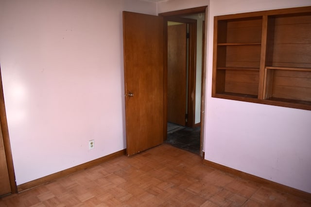 interior space featuring baseboards