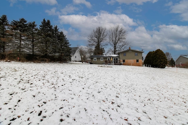 view of snow covered property