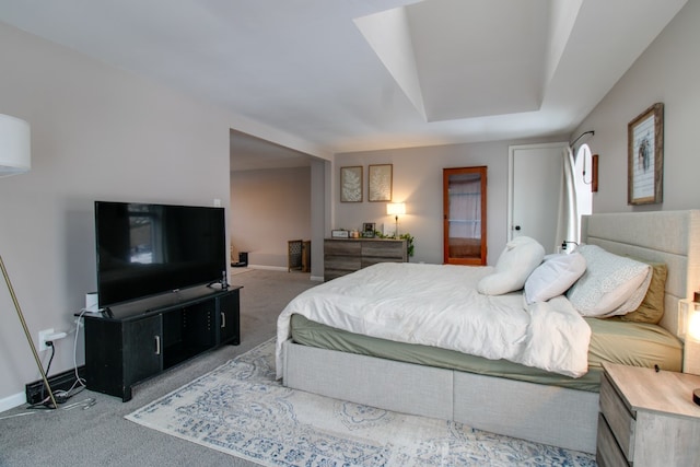 carpeted bedroom featuring baseboards