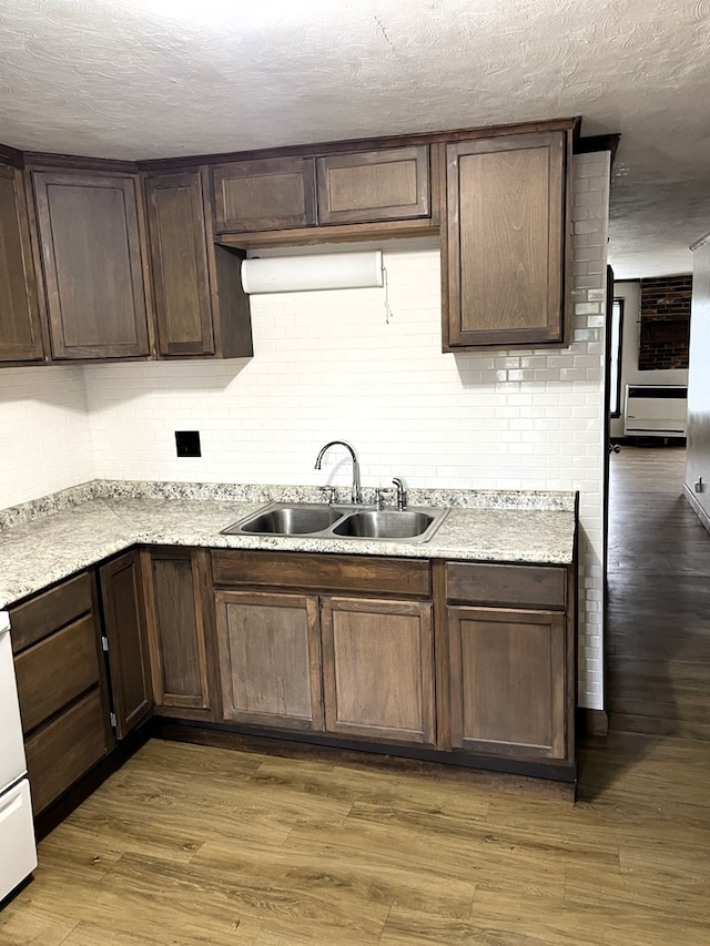 80 Main St, Shelby, OH 44875 - kitchen with dark brown cabinets, light wood-style floors, and a textured ceiling
