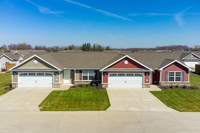 craftsman house featuring stone siding, driveway, and a front yard