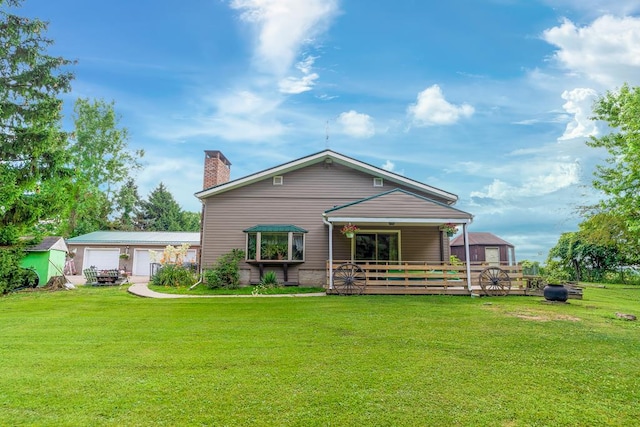 1163 Bowen Rd, Mansfield, OH 44903 - rear view of house featuring a chimney, a lawn, and a detached garage