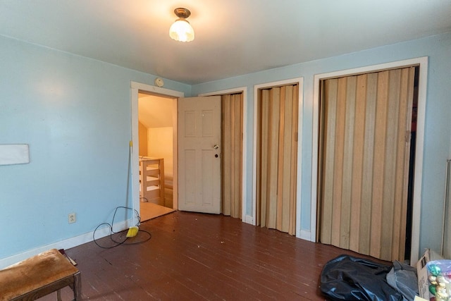 780 Pulver List Rd, Mansfield, OH 44905 - unfurnished bedroom featuring multiple closets and wood finished floors