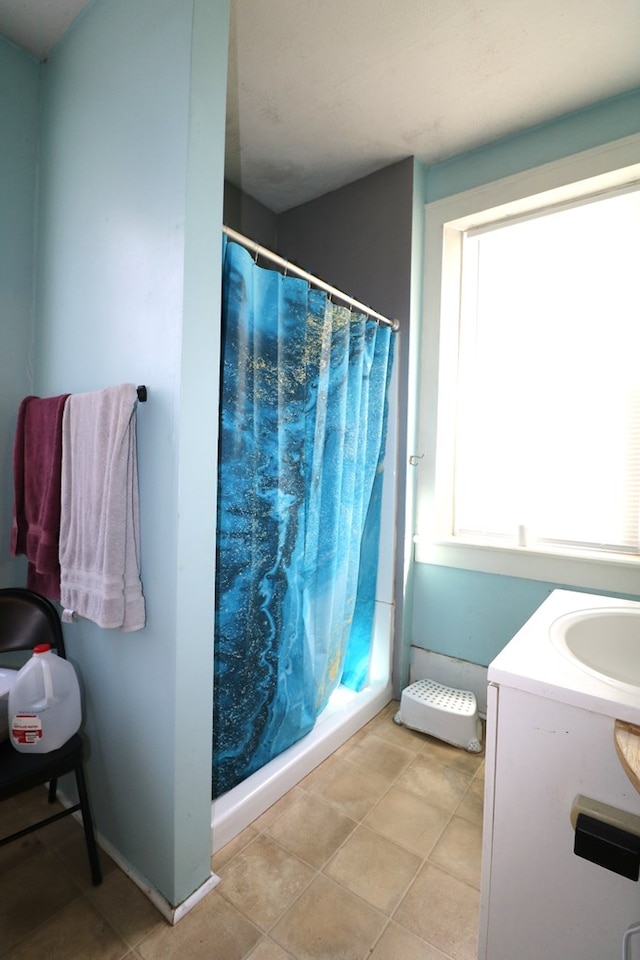 11914 State Route 269, Bellevue, OH 44811 - full bath with tile patterned floors, vanity, and a shower with shower curtain