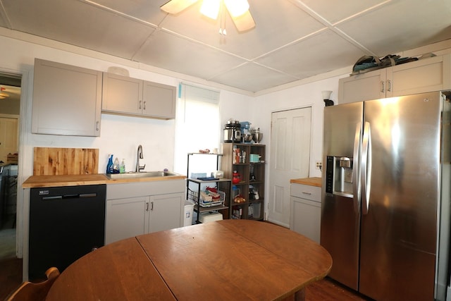 11914 State Route 269, Bellevue, OH 44811 - kitchen featuring a sink, butcher block countertops, dishwasher, ceiling fan, and stainless steel fridge with ice dispenser