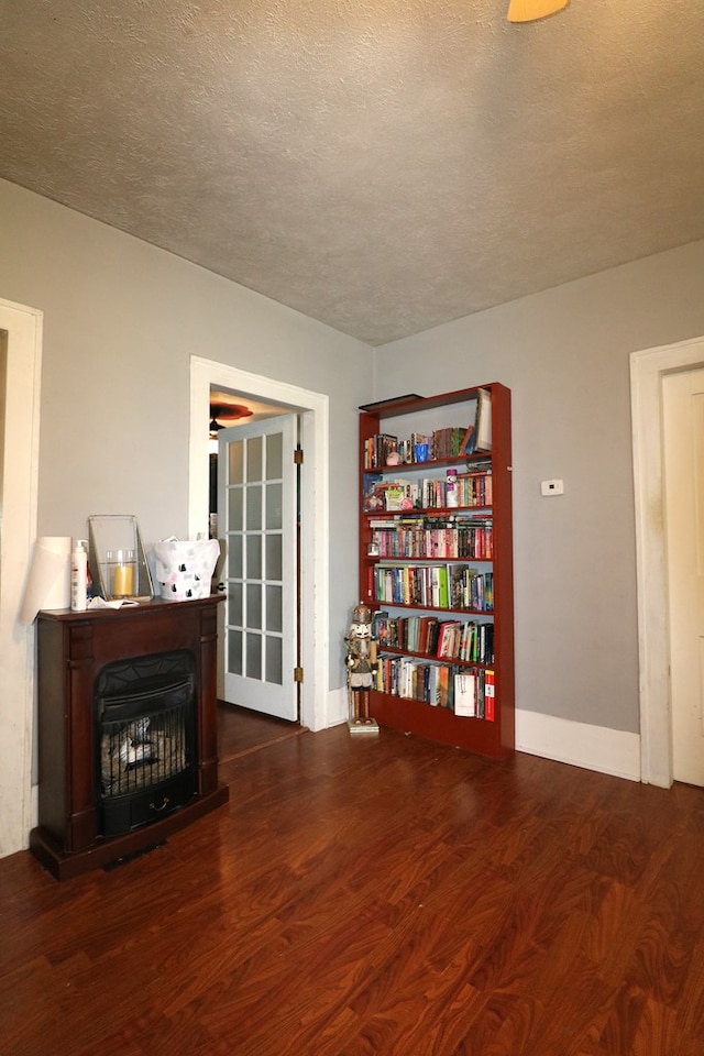 11914 State Route 269, Bellevue, OH 44811 - sitting room featuring baseboards, wood finished floors, and a textured ceiling
