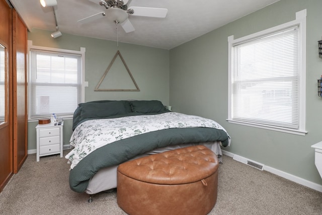 623 Bendle Ave, Shelby, OH 44875 - bedroom featuring carpet, multiple windows, baseboards, and ceiling fan