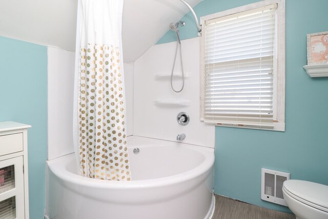 623 Bendle Ave, Shelby, OH 44875 - bathroom featuring tub / shower combination, toilet, and wood finished floors